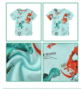 Detailed close-up of mint blue cotton fabric and cartoon dinosaur print on kids T-shirt
