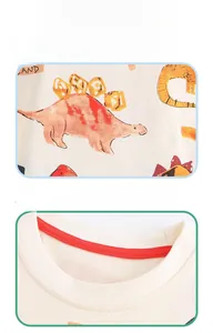 Detail of red ribbed crew neck and colorful cartoon dinosaur print on cotton kids T-shirt