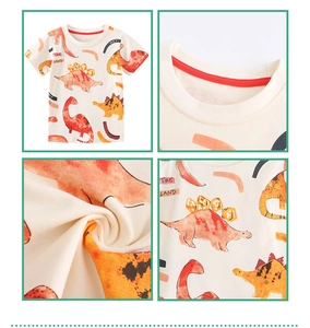 Detail of kids cotton T-shirt showing dinosaur prints and red ribbed neckline