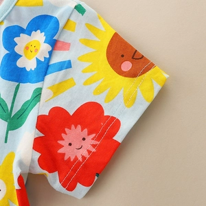 Short sleeve girls' cotton dress with light blue fabric and colorful cartoon floral print