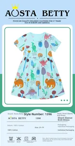 Détail de la robe en coton à manches courtes avec motifs dinosaures et guide des tailles