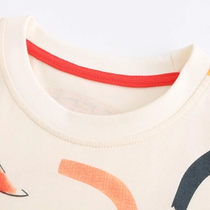 Kids beige cotton T-shirt featuring cartoon dinosaur print and red reinforced neckline