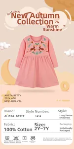 Close-up of reindeer and floral embroidery on a 100% cotton pink long-sleeved dress