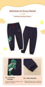 Close-up of navy cotton boys joggers featuring green dinosaur embroidery and ribbed cuffs