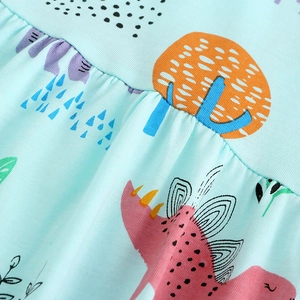 Robe en coton bleu clair pour fille avec imprimés dinosaures et détails plissés