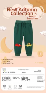 Détail du jogging en coton vert foncé pour garçons avec broderie de dinosaures mignons