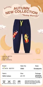 Detail view of 100% cotton kids joggers with rocket embroidery and yellow drawstring