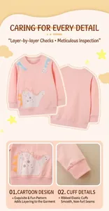 Detail of cartoon dinosaur embroidery and ribbed cuffs on pink girls sweatshirt