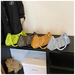 Collection of pleated cloud bags in neon green, black white, orange, and blue with rope straps