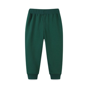 Dark green kids cotton sweatpants featuring elastic waist and ribbed cuffs on white backdrop
