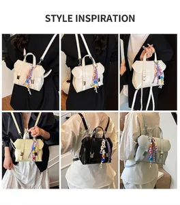 Detailed view of women's casual PU leather backpack with colorful beaded charm accessory
