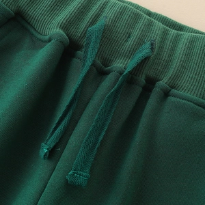 Pantalon de sport garçon vert foncé en coton tricoté avec taille élastique et cordon
