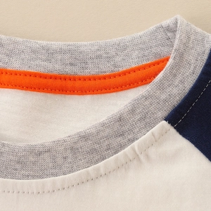 Kids long sleeve pumpkin T-shirt with contrast raglan sleeves and ribbed crew neck