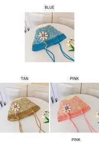 Three summer straw hats in blue, brown, and pink with woven flowers and adjustable ties
