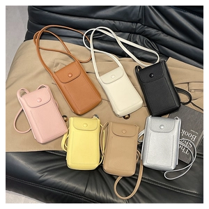 Detailed display of seven colored textured leather mobile phone bags with round snap closure