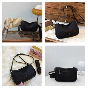 Vue détaillée des sacs polochons en toile noir et beige avec larges bandoulières