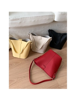 Multiple bucket bags in yellow, white, black, and red with soft lychee grain texture