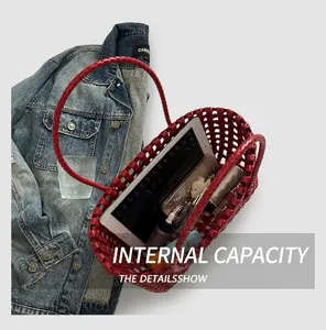 Top view of red woven leather tote bag interior showing large capacity for essentials
