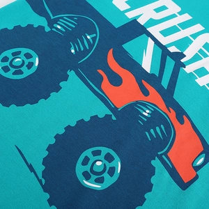 Boy's teal cotton T-shirt featuring a monster truck print with red flames and CRUSH text