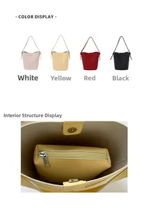 Detail showing litchi grain leather bucket bag with magnetic clasp and inner zip pouch