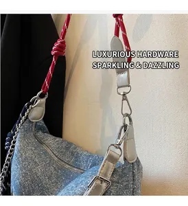 Detailed close-up of blue glitter crossbody bag with red and white woven shoulder strap
