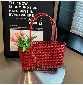 Detailed texture of red hollow woven tote bag with tulip flowers in a modern setting