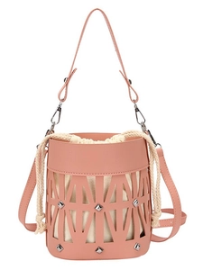 Pink hollowed-out leather bucket bag with silver studs and white drawstring inner pouch