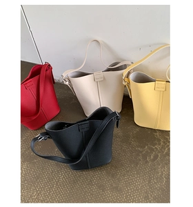 Litchi pattern leather bucket bags in red, white, yellow, and black colors