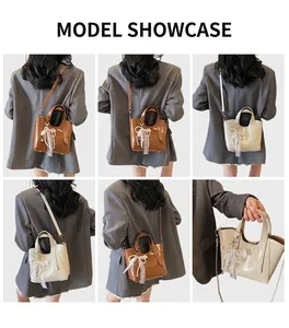 Detail showing brown and white bucket bags with lace bows and adjustable straps