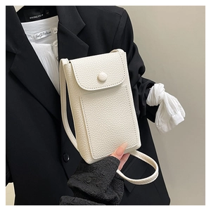 Detail of white litchi grain leather crossbody phone bag with premium metal snap button