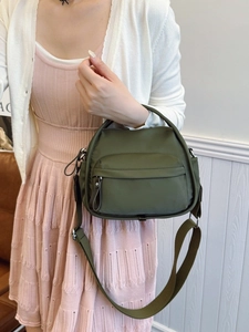 Minimalist olive green nylon crossbody bag for women with wide adjustable shoulder strap