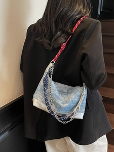 Minimalist light blue tote bag with multi-strand rope straps and silver leather trim