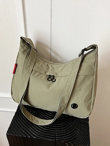 Olive green nylon shoulder bag with large capacity and multi-pocket design for travel