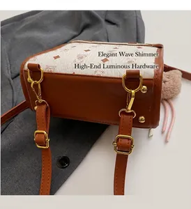 Detail shot of the reinforced bottom with golden studs on a vintage bear print handbag