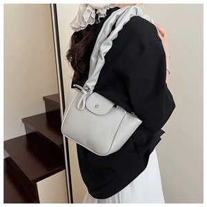 Fashionable gray pleated shoulder bag for women styled as an elegant underarm clutch
