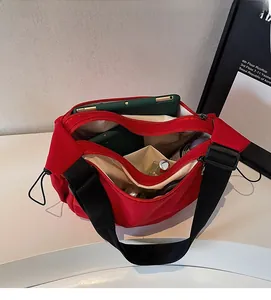 Top view of red nylon tote bag interior showing large capacity and multi-pocket storage