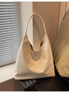 Minimalist creamy white large capacity hobo bag in soft textured leather for daily commute