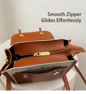 Close-up of smooth gold zipper and spacious interior on the vintage contrast handbag