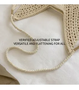 Close-up of cream woven star bag showing smooth long shoulder strap and crochet texture