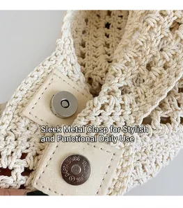 Detail of the high-quality circular magnetic metal clasp on the beige woven straw tote bag