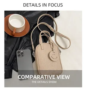 Mini beige lychee leather bag size comparison with smartphone and a smiley charm