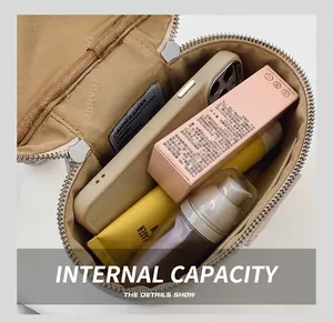 Detailansicht des Innenraums der Box-Tasche mit Platz für Make-up und Smartphone