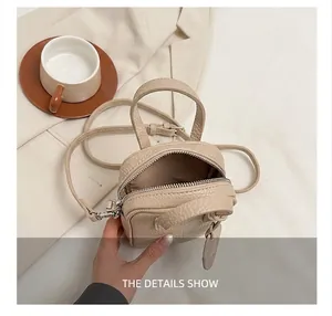 Interior view of beige lychee pattern crossbody bag showing storage capacity