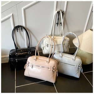 Macro shot of Boston handbags in black, apricot, off-white, and light blue finishes