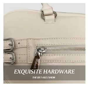 Detail of silver zipper and ivory leather stitching on a commuter boston handbag