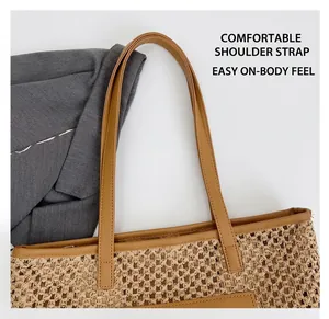 Detail showing high-quality woven straw texture and durable brown leather shoulder strap