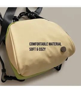 Detail of lightweight waterproof shell bag featuring contrast cream and green fabric