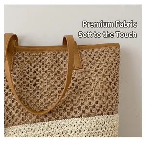 Close-up of two-tone woven tote bag fabric texture with premium leather strap detail