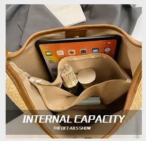 Interior view of straw tote bag showing large capacity with internal zipper compartment