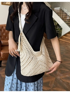 Vintage cream crochet tote bag with boho tassel detail for summer vacations